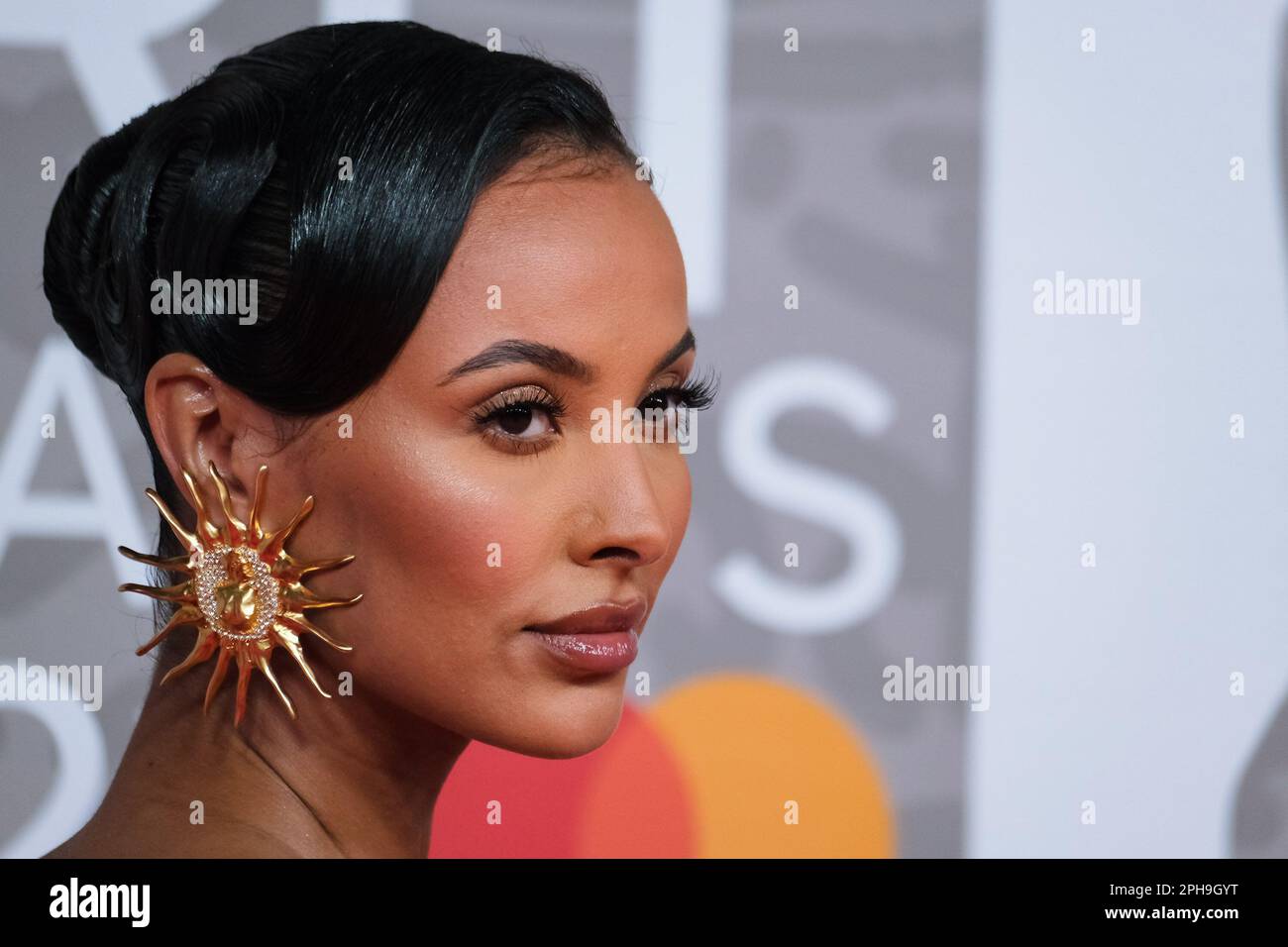 Maya Jama photographed attending The BRITS Red Carpet Arrivals at The O2 in London, UK on 11 February 2023 . Picture by Julie Edwards. Stock Photo