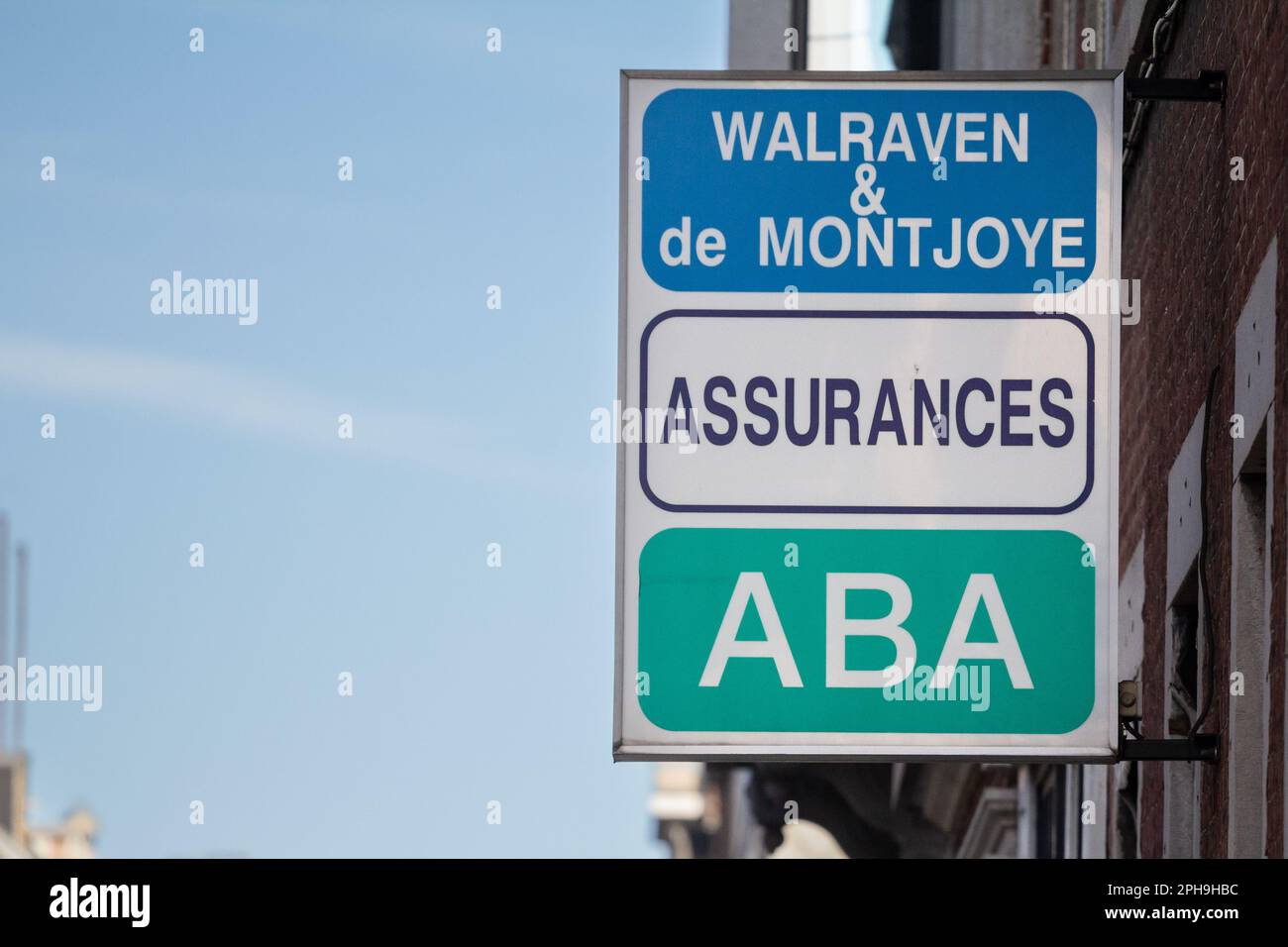 Picture of a sign with the logo of walraven et de montjoye insurances, a local insurer, called assurances, in the city center of Liege, in Belgium. Stock Photo