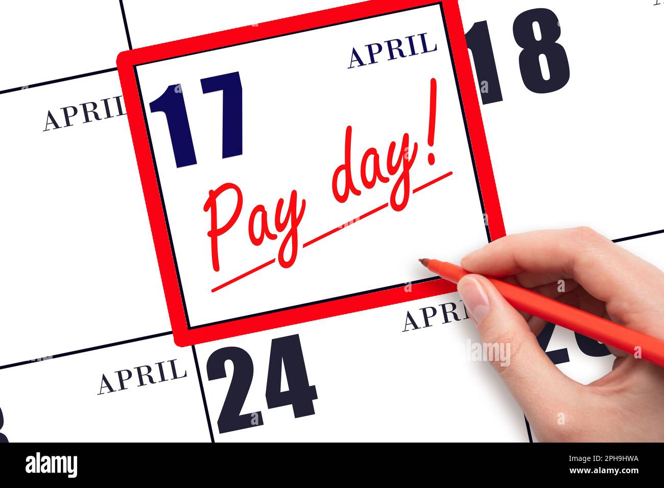 17th day of April. Hand writing text PAY DATE on calendar date April 17 and underline it. Payment due date. Reminder concept of payment. Spring month, Stock Photo