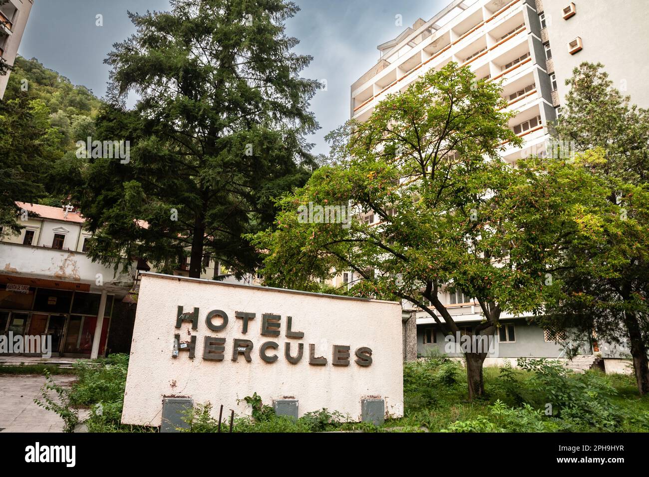 Picture of the abandoned hotel of hotel hercules in baile Herculane. it's a socialist architecture resort in the city of baile herculane. Băile Hercul Stock Photo