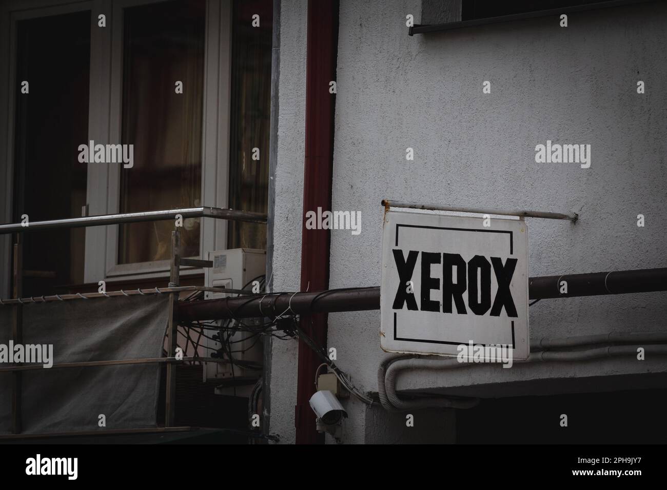 Picture of an old sign with the logo of Xerox in front of a printing house in Caransebes, Romania. Xerox Corporation is an American global corporation Stock Photo