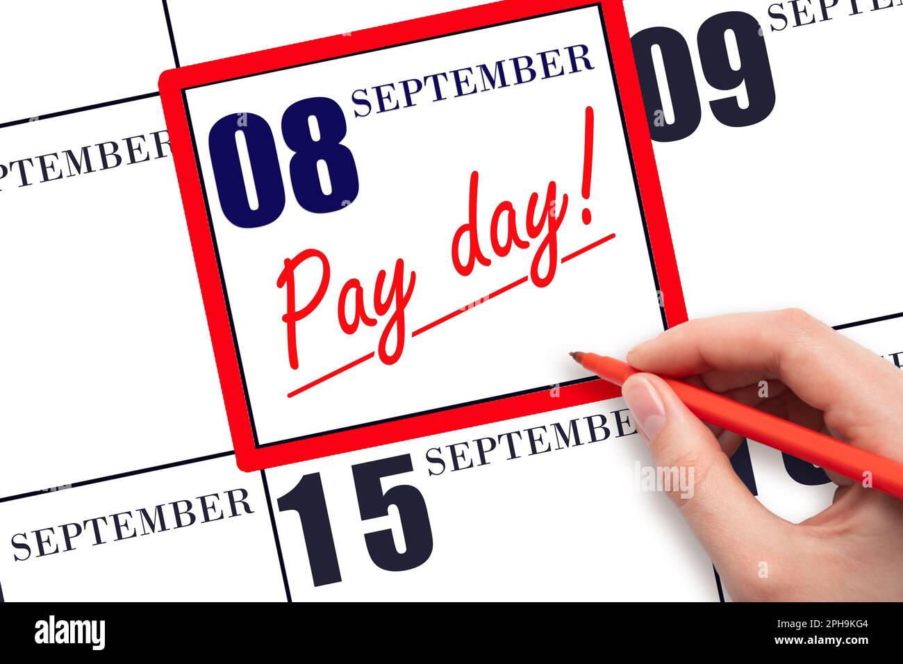 8th day of September. Hand writing text PAY DATE on calendar date September  8 and underline it. Payment due date.  Reminder concept of payment. Autum Stock Photo