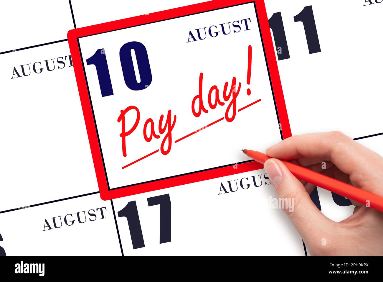 10th day of August. Hand writing text PAY DATE on calendar date August 10 and underline it. Payment due date. Reminder concept of payment. Summer mont Stock Photo
