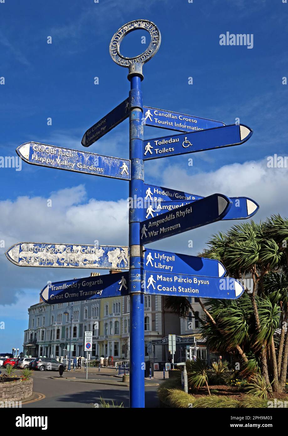 Weatherworn Llandudno attractions, signposted to Pier, Town Centre
