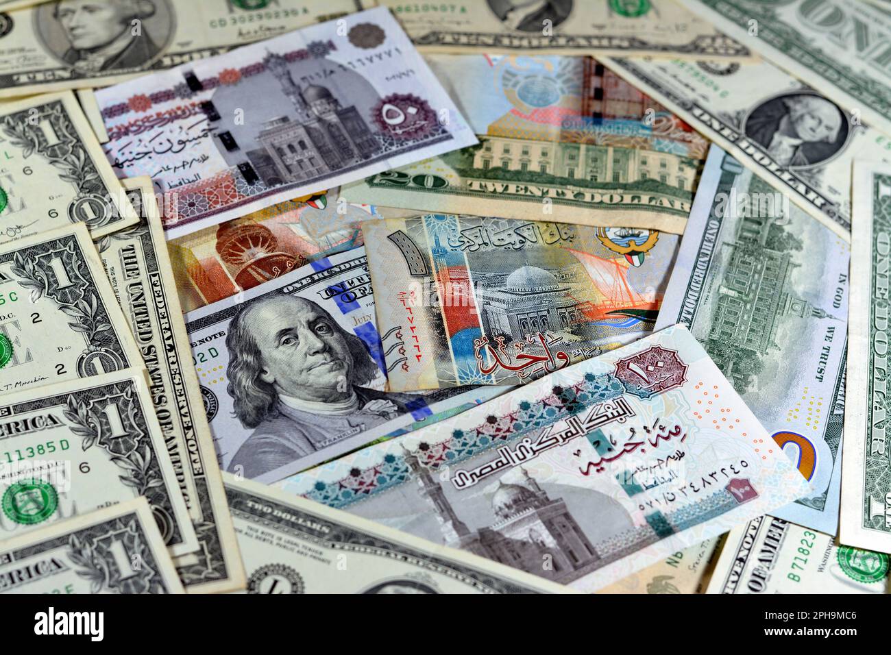 Egyptian Pounds Currency With American USA Dollars Cash Money Banknotes egyptian-pounds-currency-with-american-usa-dollars-cash-money-banknotes