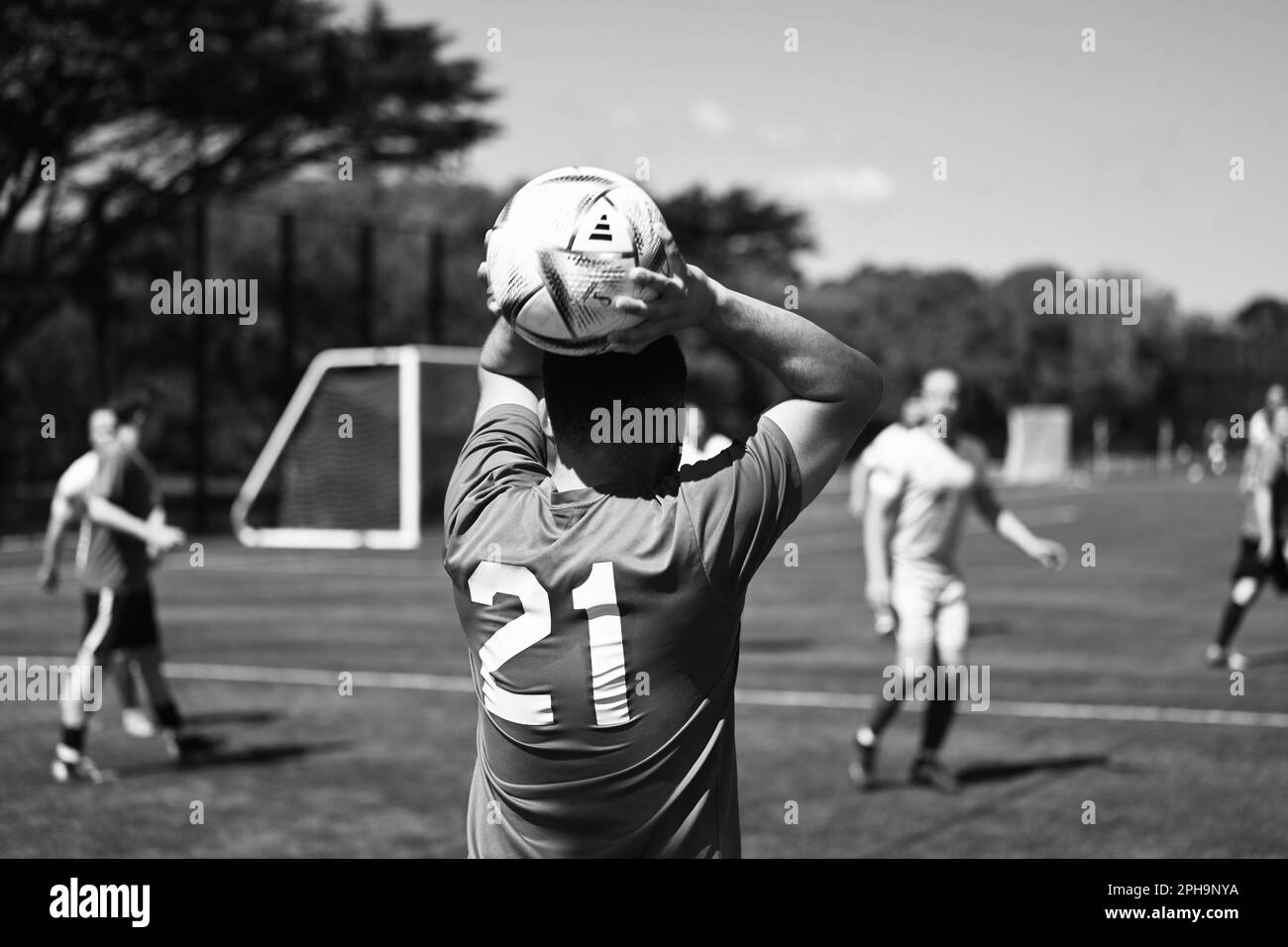 A group of individuals is engaging in a riveting game of soccer on a