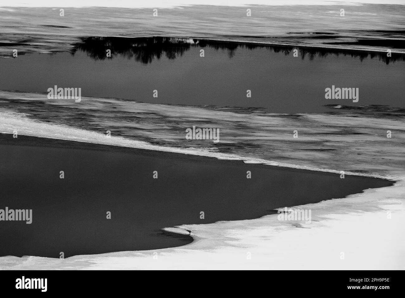 Ice drift on the river in black and white Stock Photo