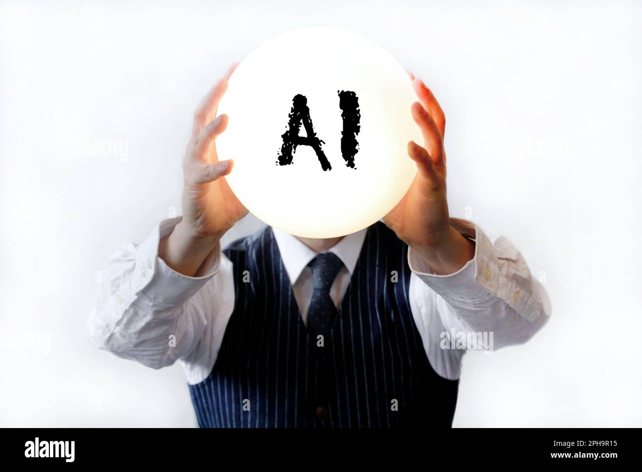 Businessman with a big shiny lamp instead of a head, with the word AI written on it Stock Photo