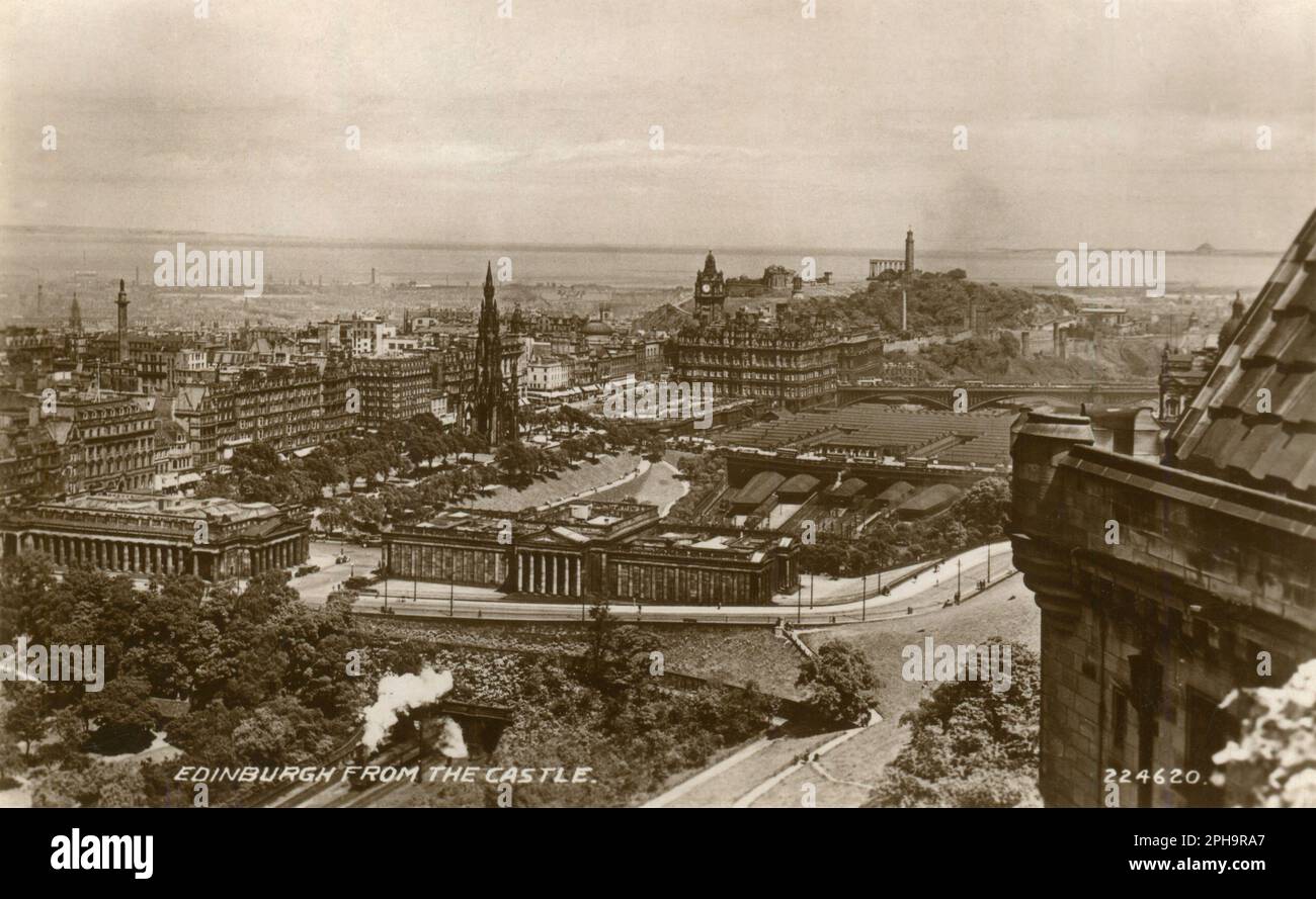 Edinburgh, Scotland. A vintage postcard entitled “Edinburgh From the Castle”, depicting a view of Edinburgh city centre from Edinburgh castle. Visible are many notable landmarks including, The National Monument of Scotland, Edinburgh Waverley Station, The Scott Monument, The Royal Scottish Academy, The Scottish National Gallery, North Bridge, The Melville Monument, and The Balmoral Hotel. Stock Photo