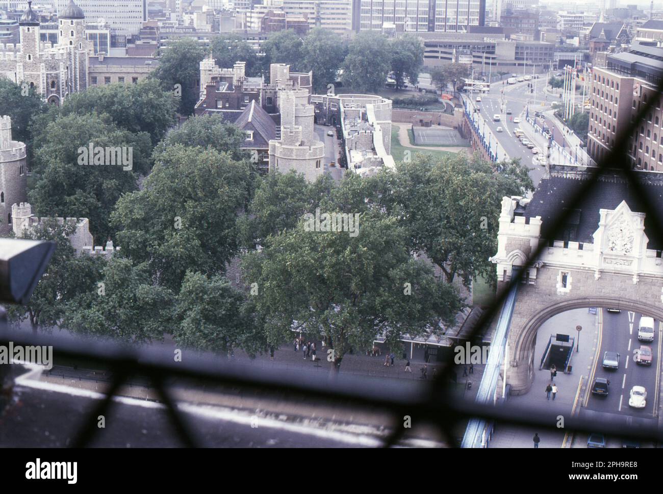 London. 1984. A view of the Tower of London and Tower Bridge Approach from the walkway of Tower Bridge, spanning the River Thames in London, England. Stock Photo