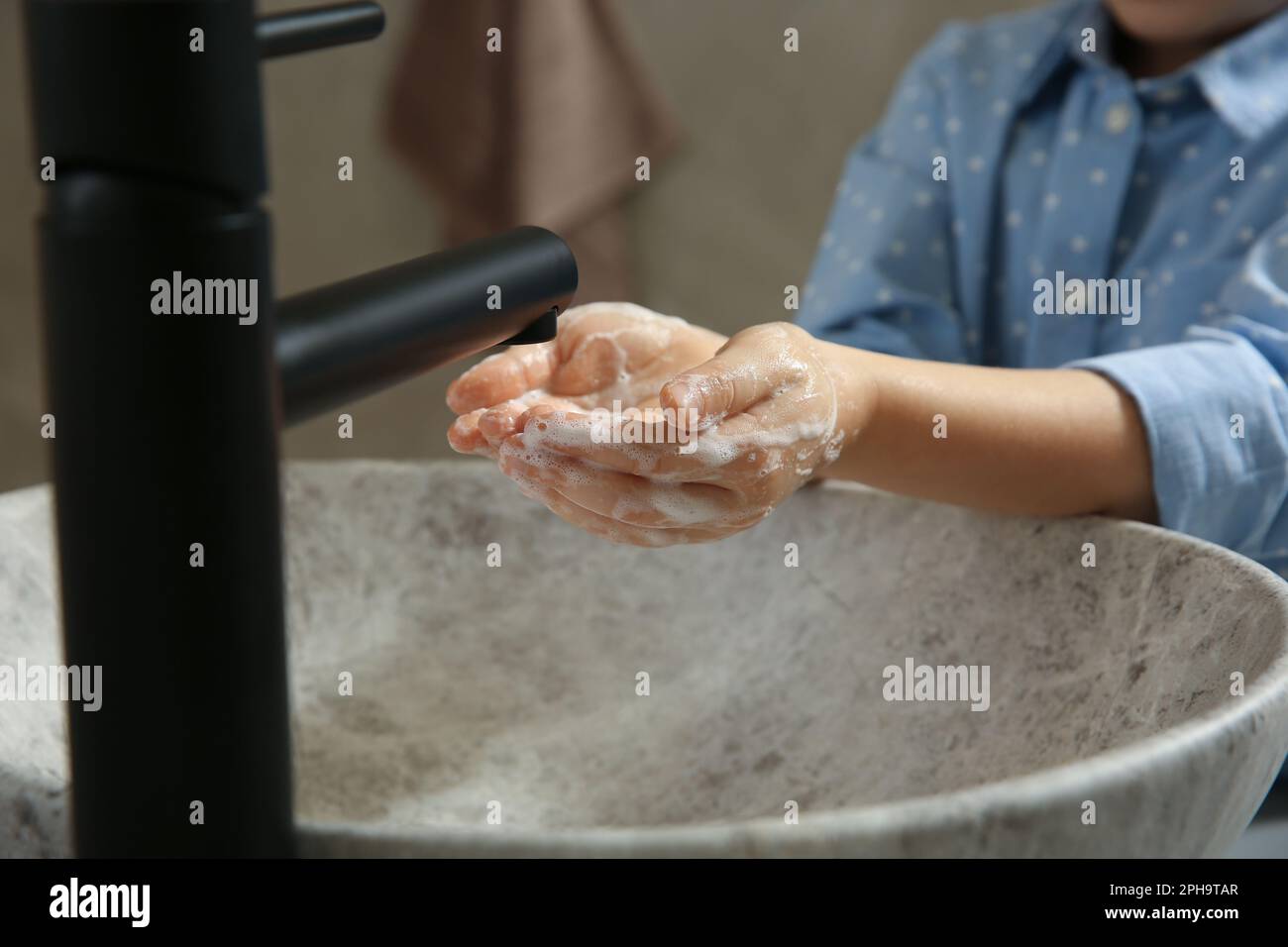 Little girl washing hands with liquid soap in bathroom, closeup Stock ...