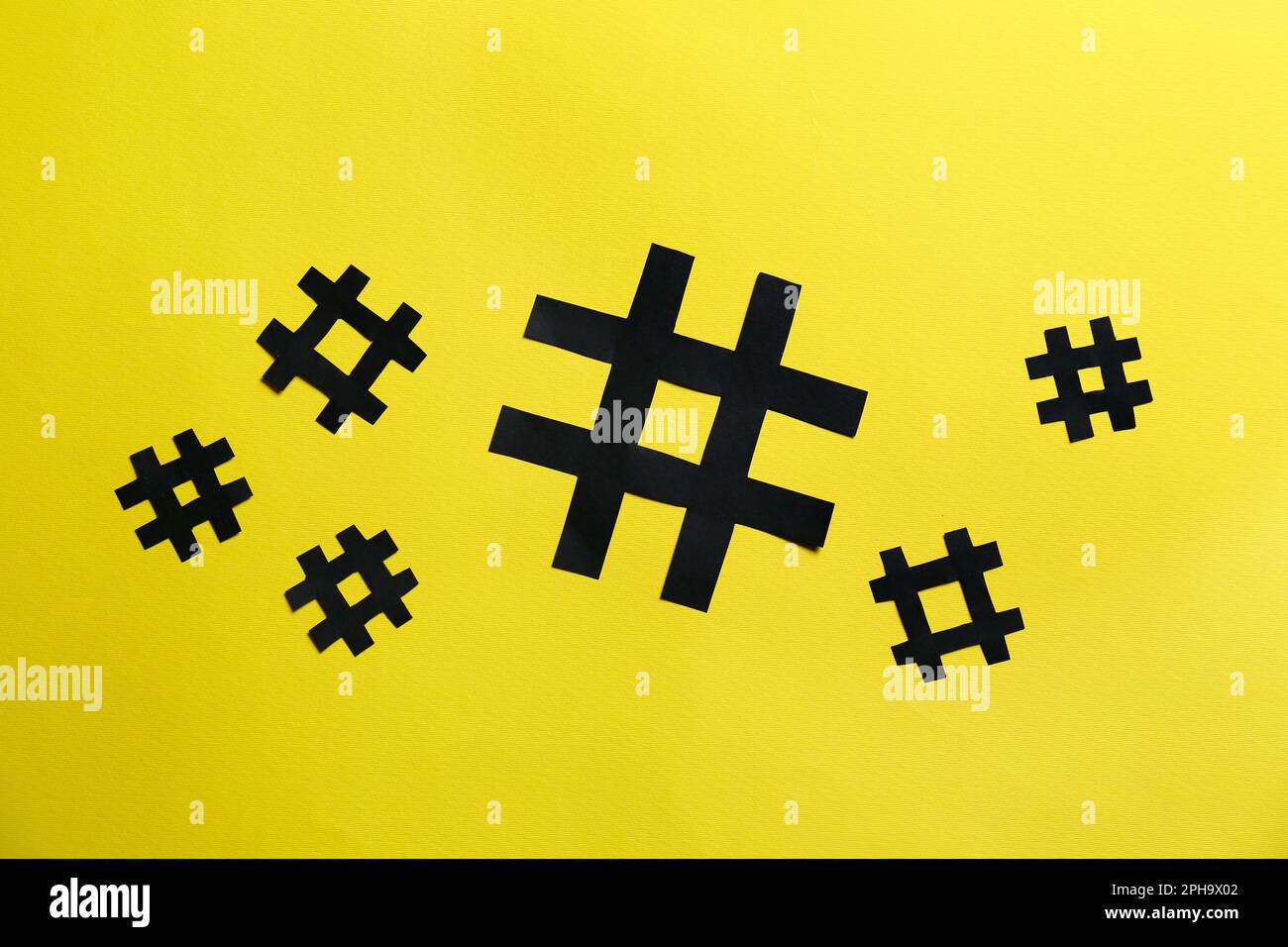 Hashtag Paper Black paper hashtag symbols on yellow background, flat lay Stock Photo ...