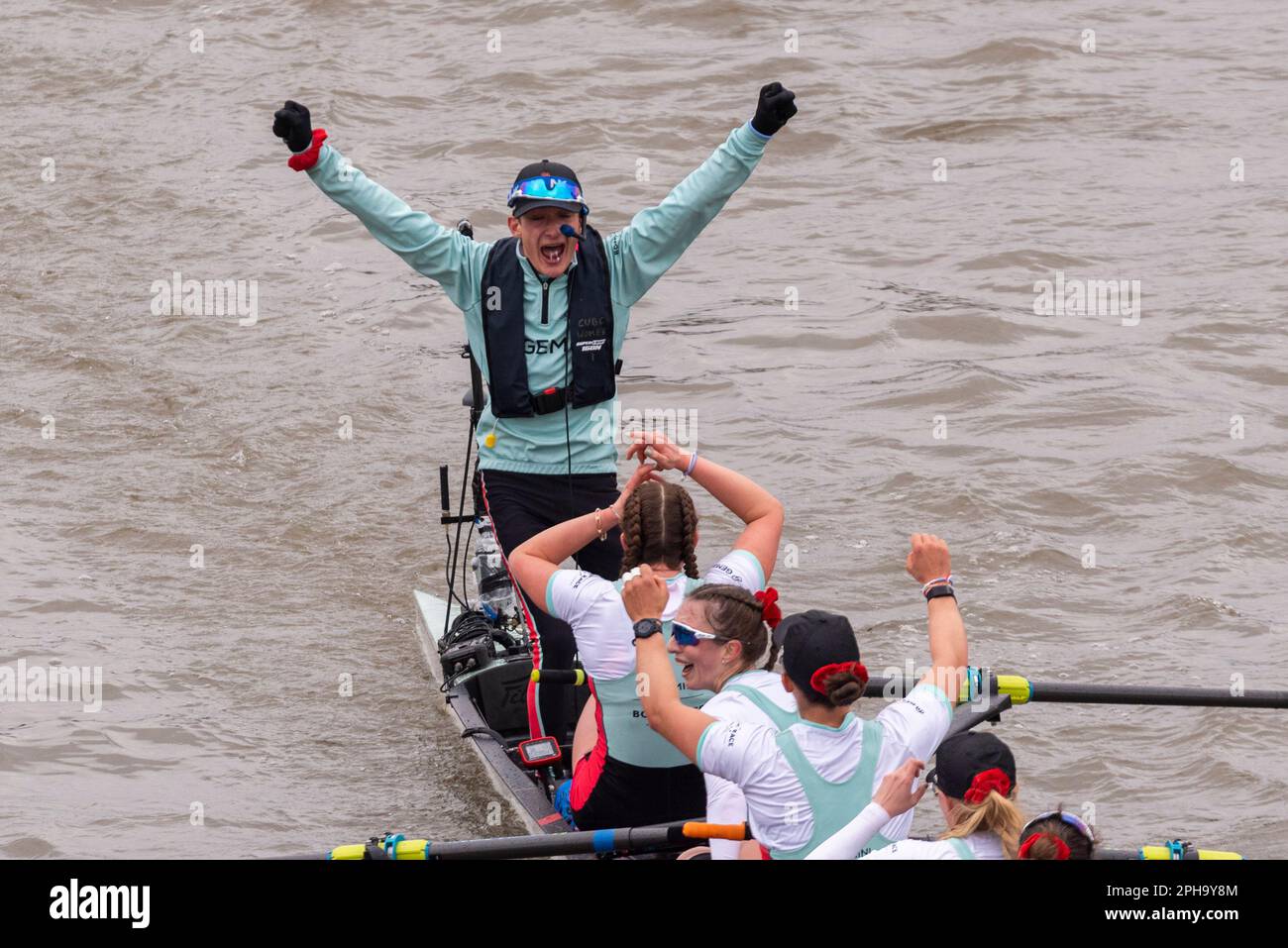 Boat Race 2023. Cambridge Women's team celebrating win after crossing