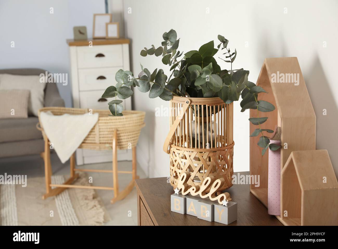 Natural home decor in wooden interior of bedroom. Bouquet of dried sticks  in vase and wicker basket at floor Stock Photo - Alamy