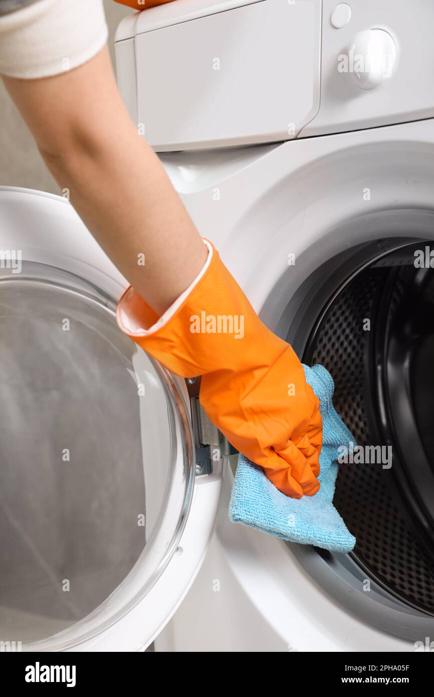 Machine White Rag Woman cleaning washing machine with rag, closeup Stock Photo - Alamy