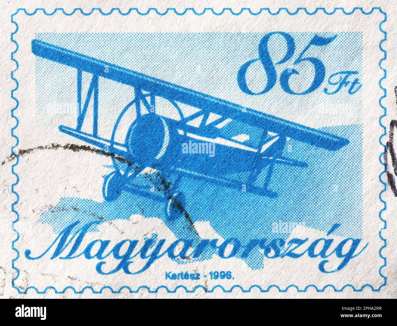 Biplane in flight on hungarian postage stamp Stock Photo
