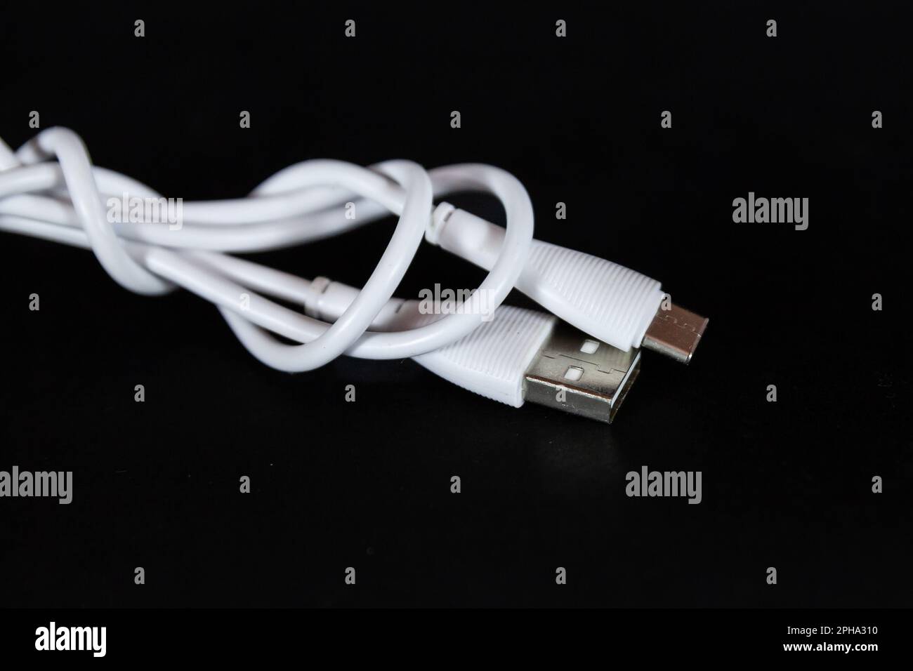 Picture of a cable with two types of port, USB A and USB C, used for