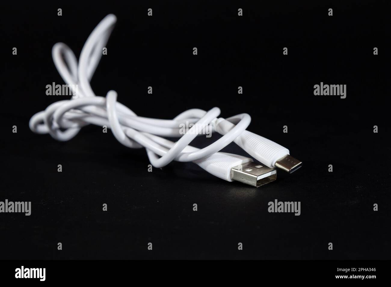 Picture of a cable with two types of port, USB A and USB C, used for
