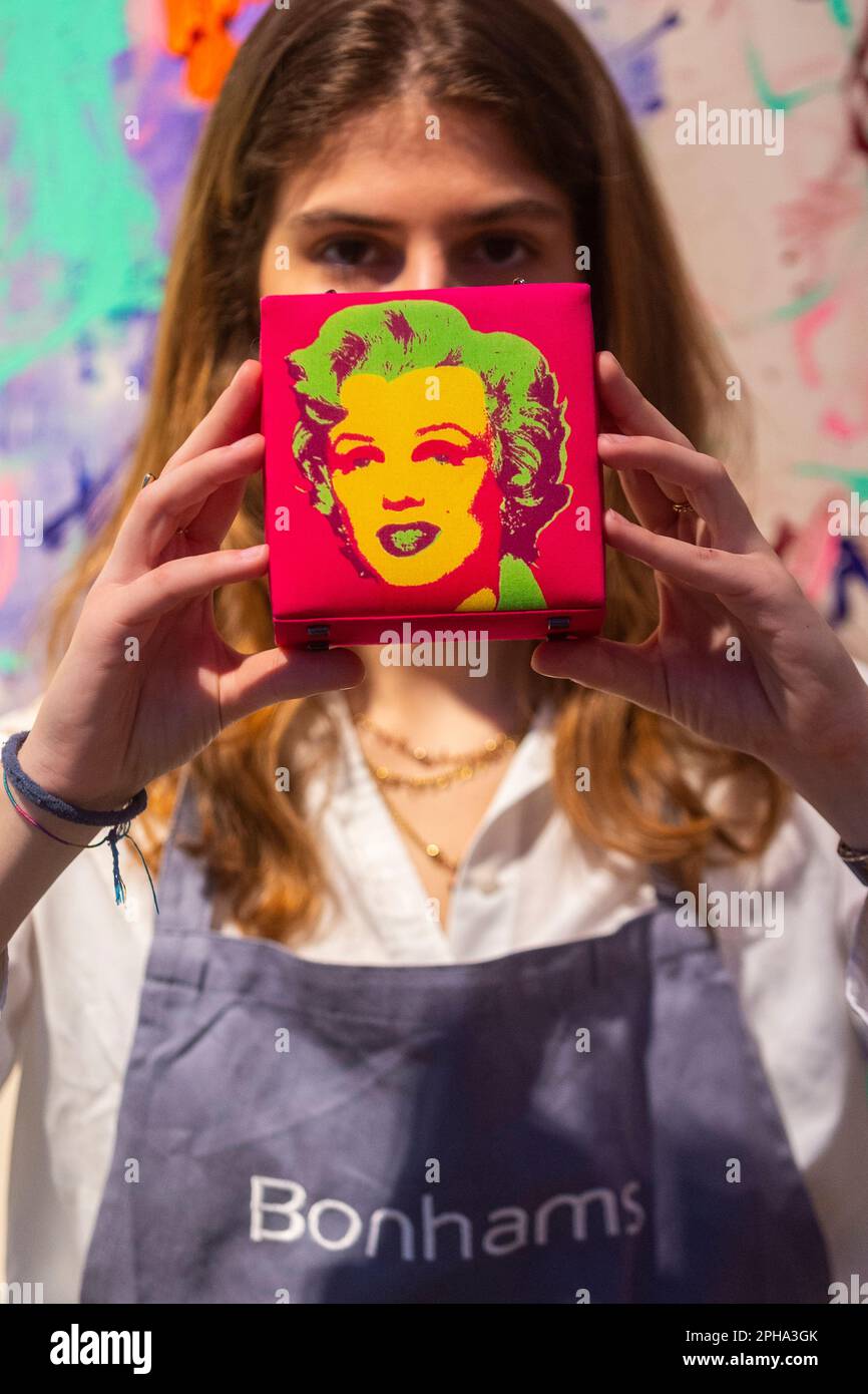 London, UK.  27 March 2023. A technician presents “One of a set of Three Marilyn Monroe Bags”, 2003, by Philip Treacy (Est. £400 - £600) at a preview of Bonham’s ‘British. Cool.’ sale.  British art, prints, fashion, photographs and popular culture memorabilia will be offered for sale at Bonham’s New Bond Street galleries on 29 March  Credit: Stephen Chung / Alamy Live News Stock Photo