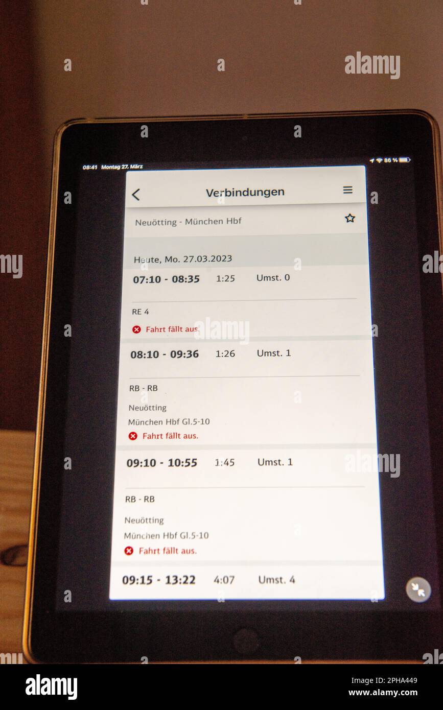 View of tablet showing train schedule with cancelled trains due to a strike called by the railroad union in Germany Stock Photo