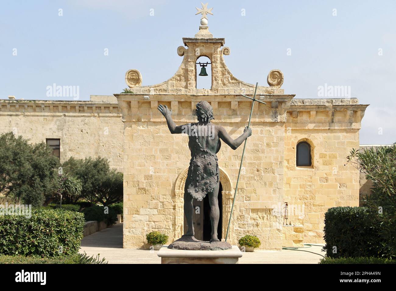 Statue of Saint Jean Baptiste (St John the Baptist) facing the Chapel of St. Anne in Fort St. Angelo which is a bastioned fort in Birgu, Malta, located at the centre of the Grand Harbour. Stock Photo