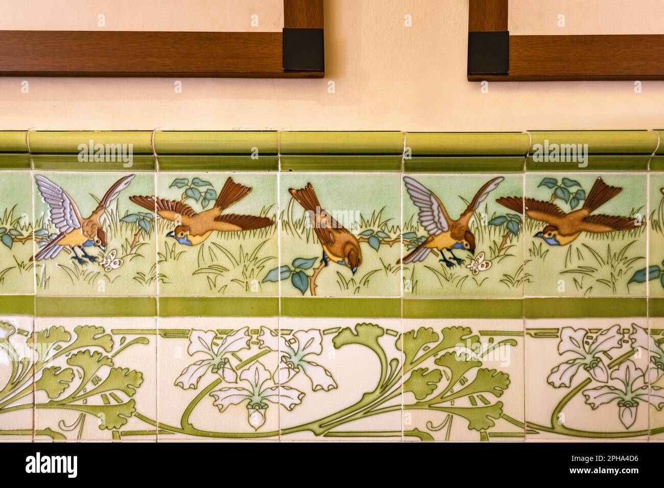 Beautiful tiles with painted images of sparrows in the nature Stock Photo