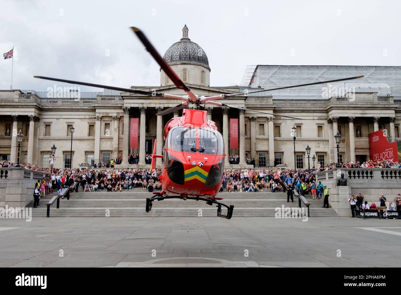 London's Air Ambulance helicopter, having delivered paramedics from the Advanced Trauma Team to a nearby road traffic incident, takes off from Trafalg Stock Photo