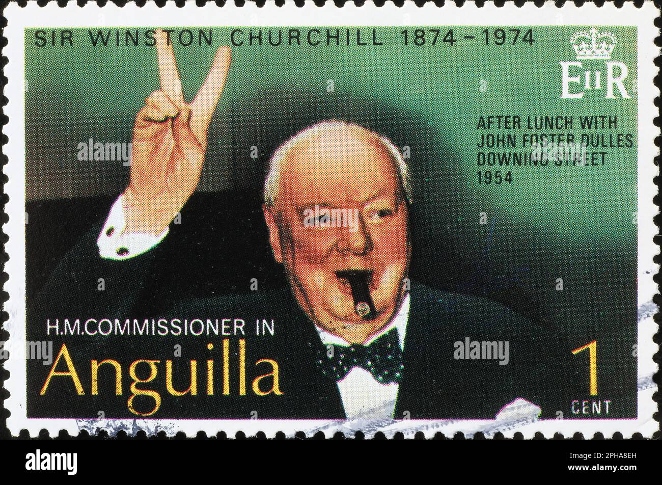 Wiston Churchill celebrating the victory on postage stamp Stock Photo