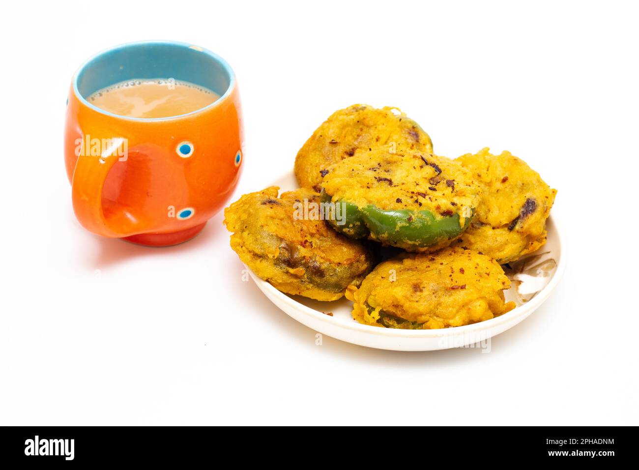 indian snacks breakfast made by capsicum and chickpea flour with tea