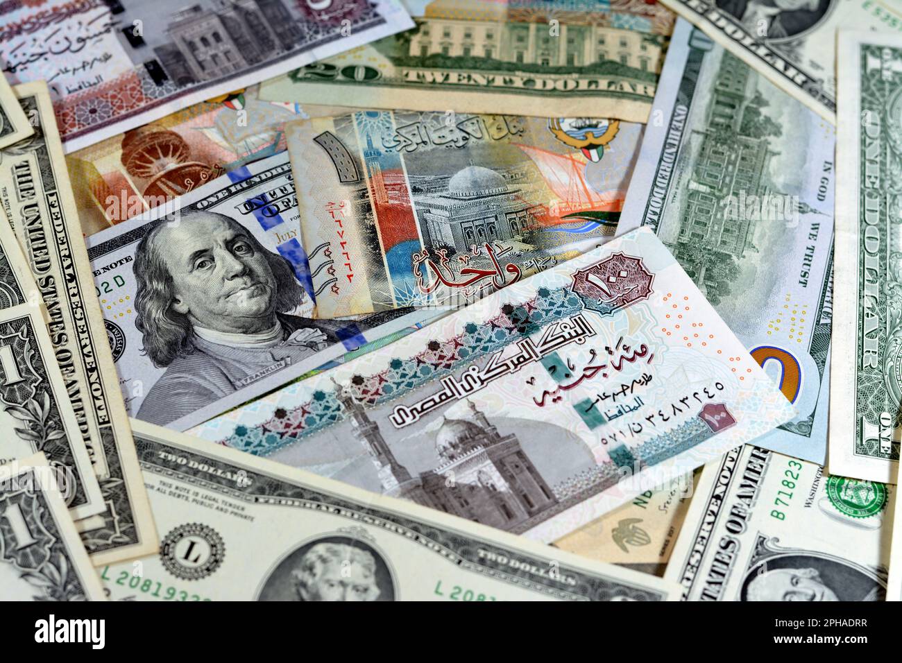 Egyptian pounds currency with American USA dollars cash money banknotes of different values and