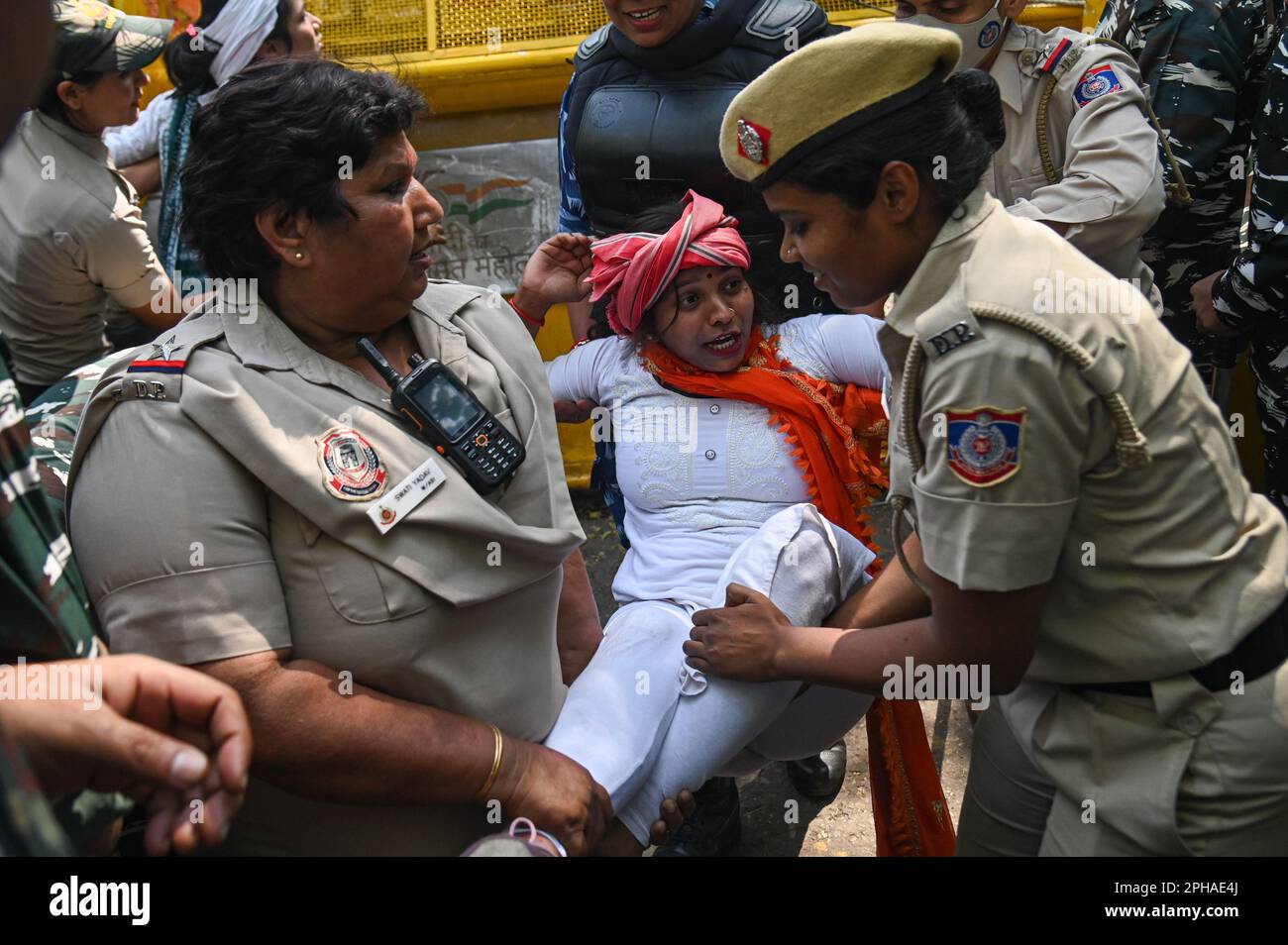 New Delhi, Delhi, India. 27th Mar, 2023. Police officers detain a supporter of Indian Youth congress after a protest against the disqualification from the Indian Parliament of India's main opposition leader of the Indian National Congress, Rahul Gandhi, in New Delhi, India on March 27, 2023. Rahul Gandhi was disqualified from the Indian Parliament, a day after a Indian Court convicted him in a defamation case and sentenced him to two years in prison. (Credit Image: © Kabir Jhangiani/ZUMA Press Wire) EDITORIAL USAGE ONLY! Not for Commercial USAGE! Credit: ZUMA Press, Inc./Alamy Live News Stock Photo