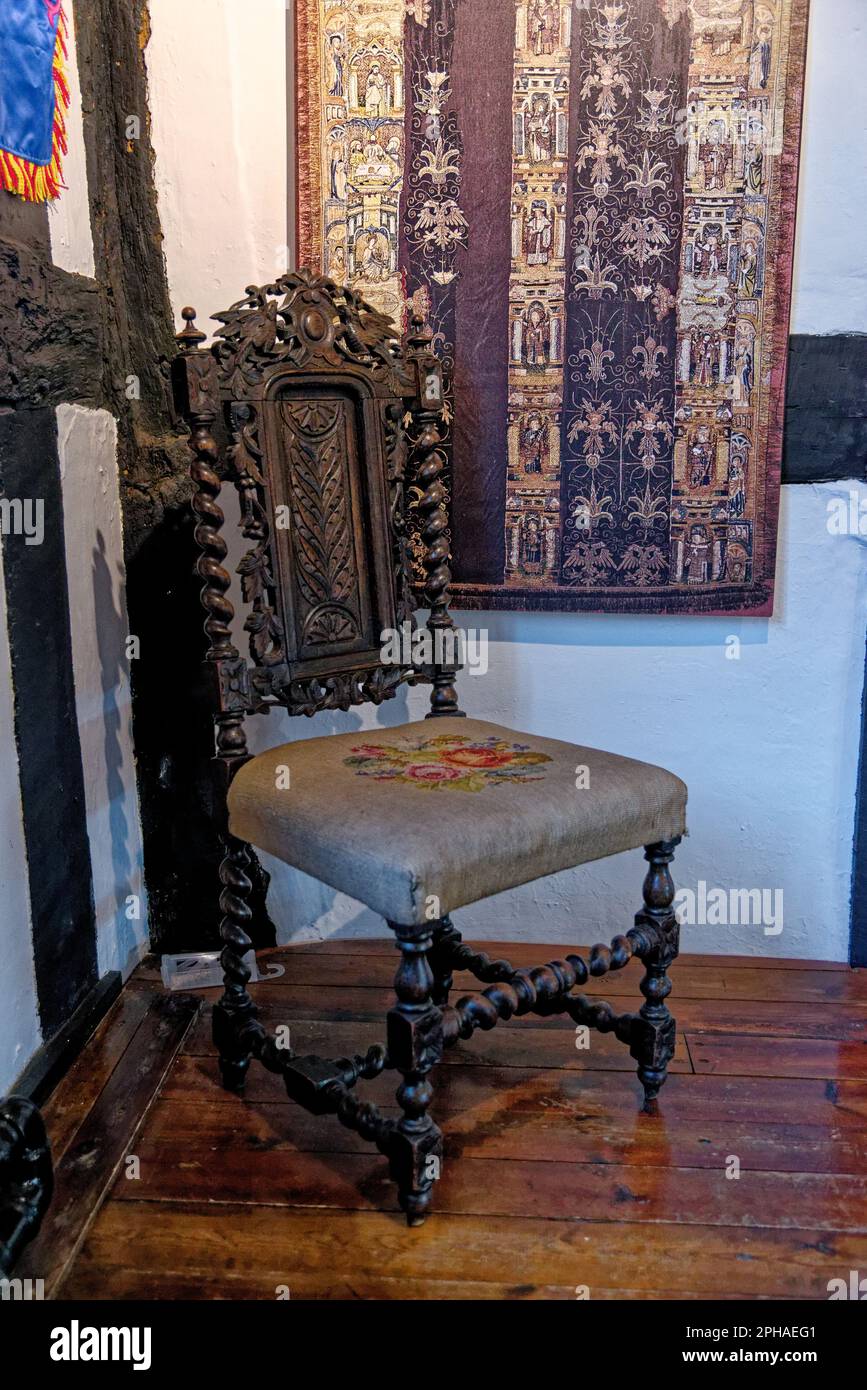 Old chair, antique wooden oak vintage furniture at Tudor House Museum Worcester, Worcestershire, England, United Kingdom - 28th of January 2023 Stock Photo