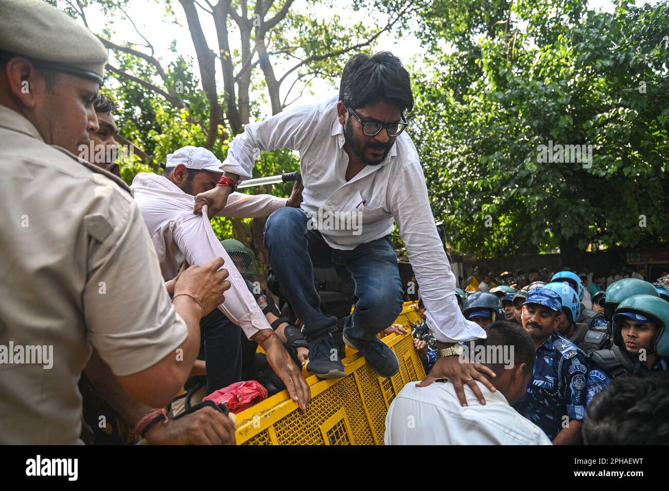 New Delhi, Delhi, India. 27th Mar, 2023. Police officers detain a supporter of Indian Youth congress after a protest against the disqualification from the Indian Parliament of India's main opposition leader of the Indian National Congress, Rahul Gandhi, in New Delhi, India on March 27, 2023. Rahul Gandhi was disqualified from the Indian Parliament, a day after a Indian Court convicted him in a defamation case and sentenced him to two years in prison. (Credit Image: © Kabir Jhangiani/ZUMA Press Wire) EDITORIAL USAGE ONLY! Not for Commercial USAGE! Credit: ZUMA Press, Inc./Alamy Live News Stock Photo