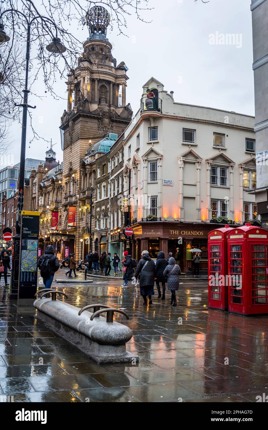 The Chandos pub, a popular pub in London's West End, and London Coliseum theatre, Covent Garden, London, England, UK Stock Photo