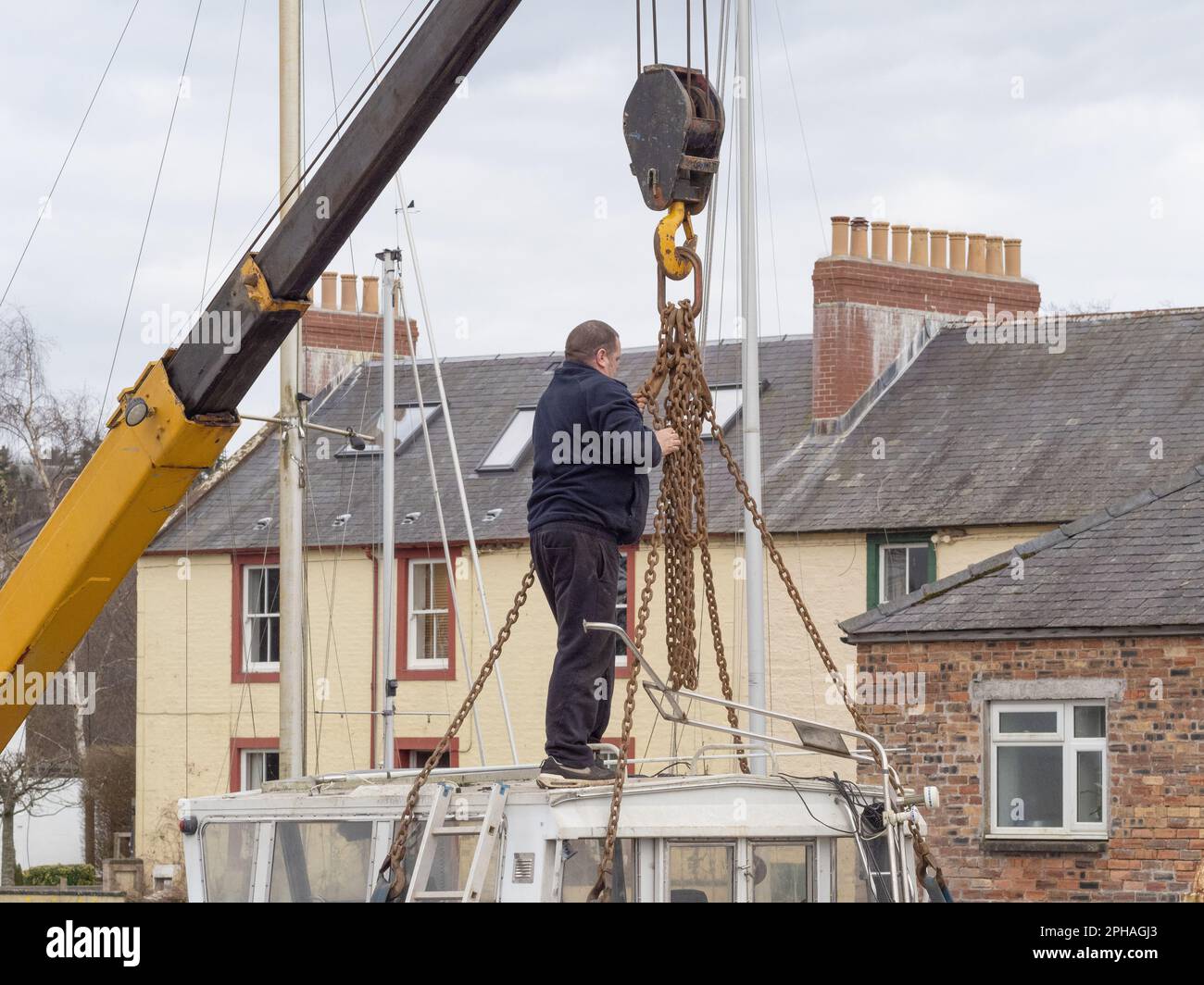 Crane lifting small boat hi-res stock photography and images - Alamy