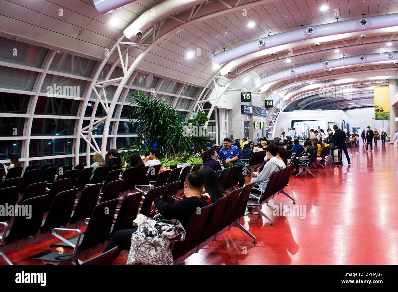 Korean people and foreign travelers passengers walking carry luggage