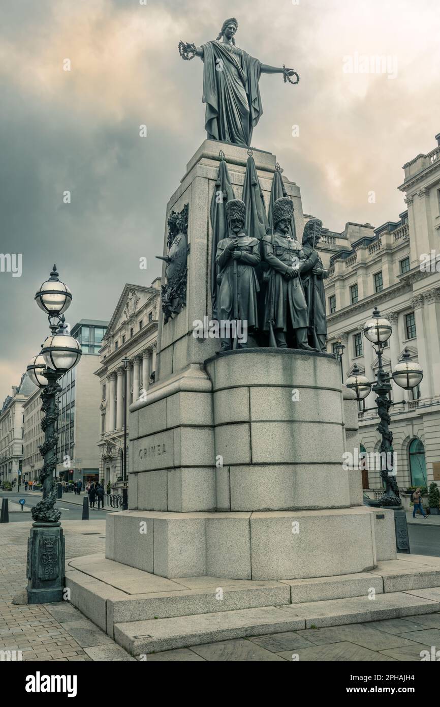The Guards Crimean War Memorial can be found at the junction of Lower Regent Street and Pall Mall in London. The Grade II listed bronze, granite and m Stock Photo