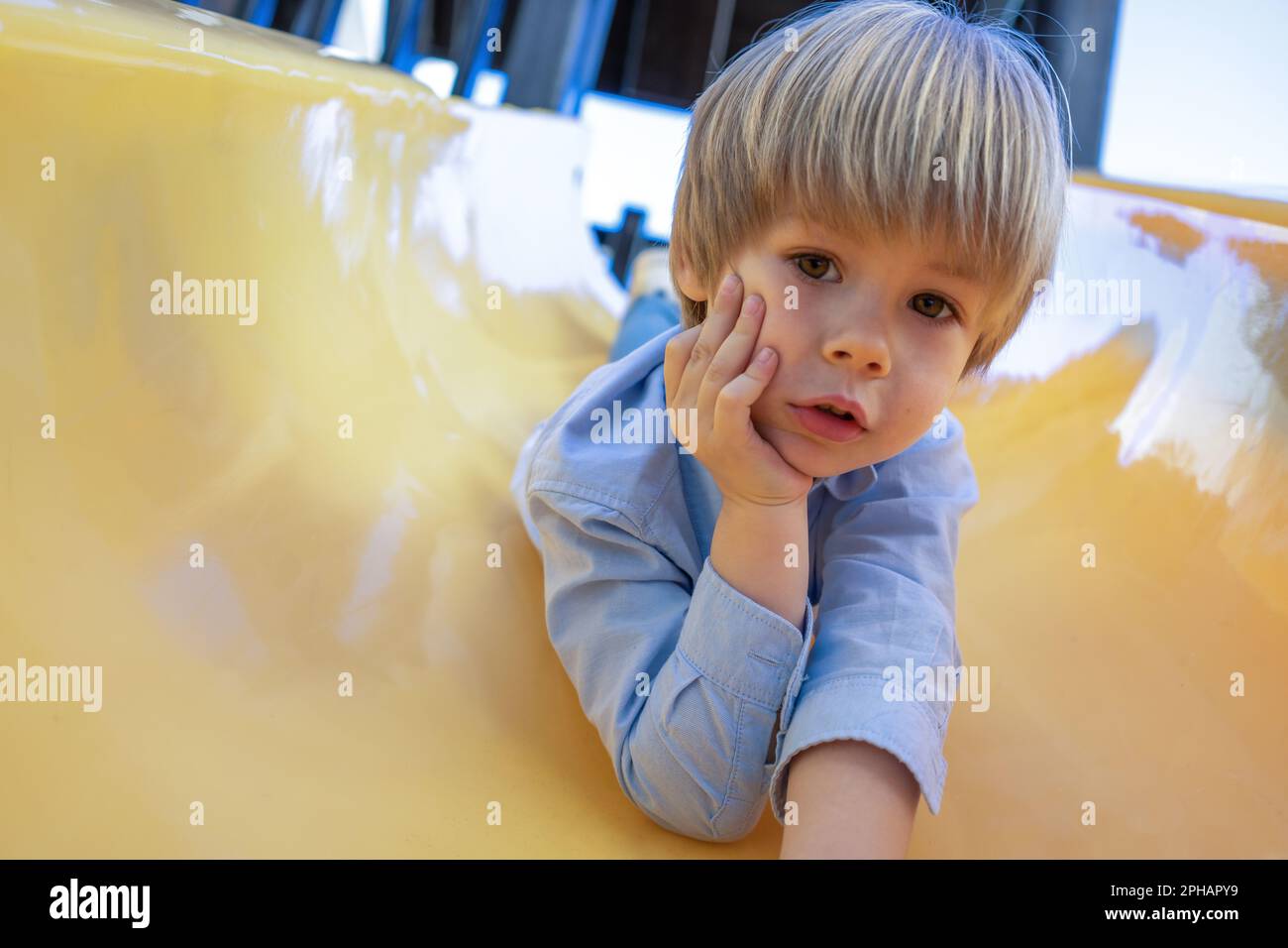 https://c8.alamy.com/comp/2PHAPY9/adorable-little-3-4-year-old-toddler-boy-having-fun-on-playground-child-boy-2PHAPY9.jpg