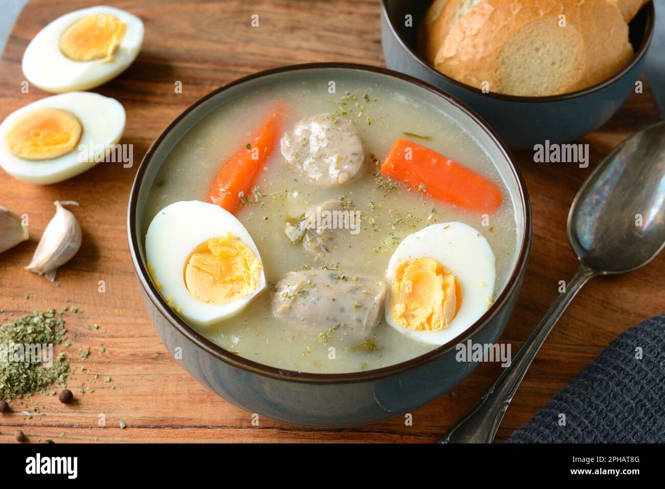 The sour soup (zurek) made of rye flour with sausage and egg. Popular Easter dish Stock Photo