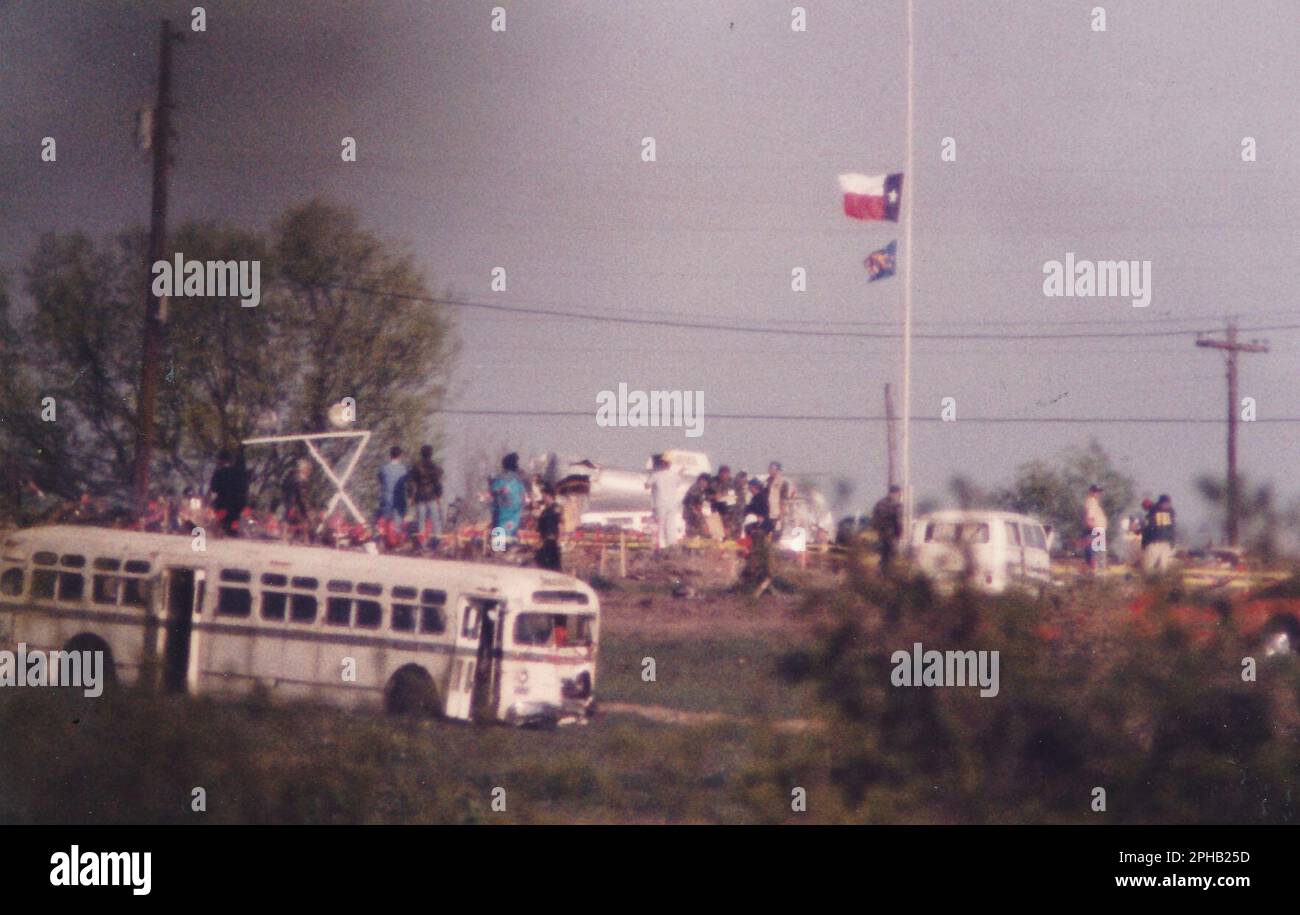 Waco, Texas USA, April 21, 1993: Federal agents investigate the scene at the Branch Davidian compound two days after a devastating fire killed 76 members holed up at the religious cult's property and ended a 51-day standoff with federal law enforcement agencies. ©Bob Daemmrich Stock Photo