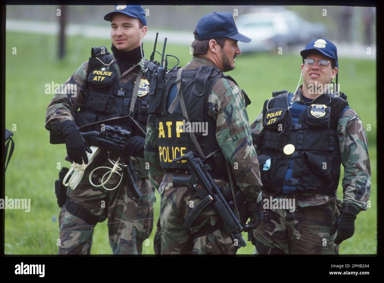 Waco Texas USA, March 1993: Heavily armed members of the federal bureau of Alcohol, Firearms and Tobacco (ATF) guard a road leading to the Branch Davidian compound in the midst of the 51-day standoff between law enforcement agencies and members of the Davidian religious group. ©Bob Daemmrich Stock Photo