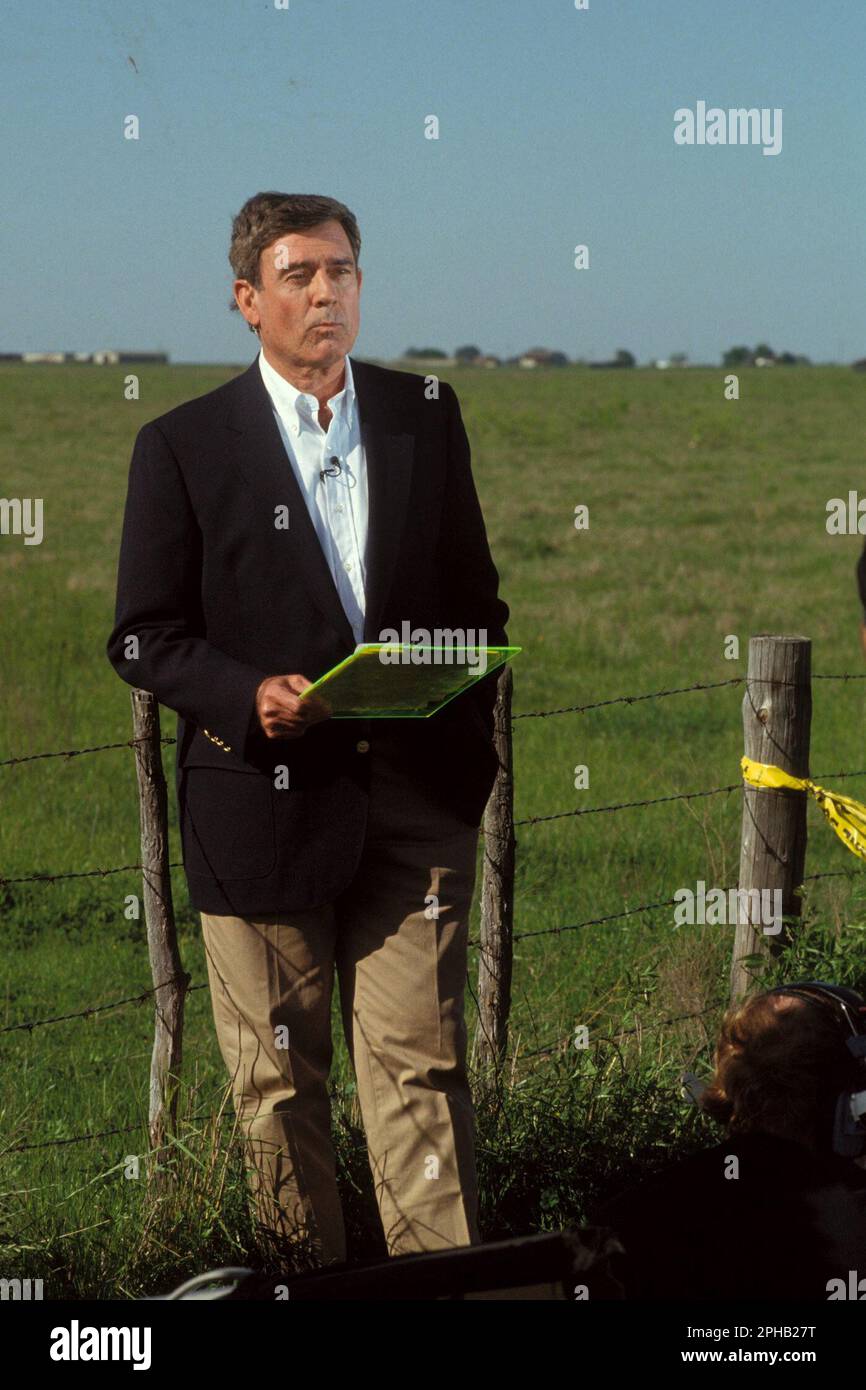 Waco Texas USA, March 1993: CBS Evening News anchor Dan Rather reports live from the media compound covering the standoff between federal law enforcement agencies and the Branch Davidian religious group holed up at nearby Mount Carmel. ©Bob Daemmrich Stock Photo