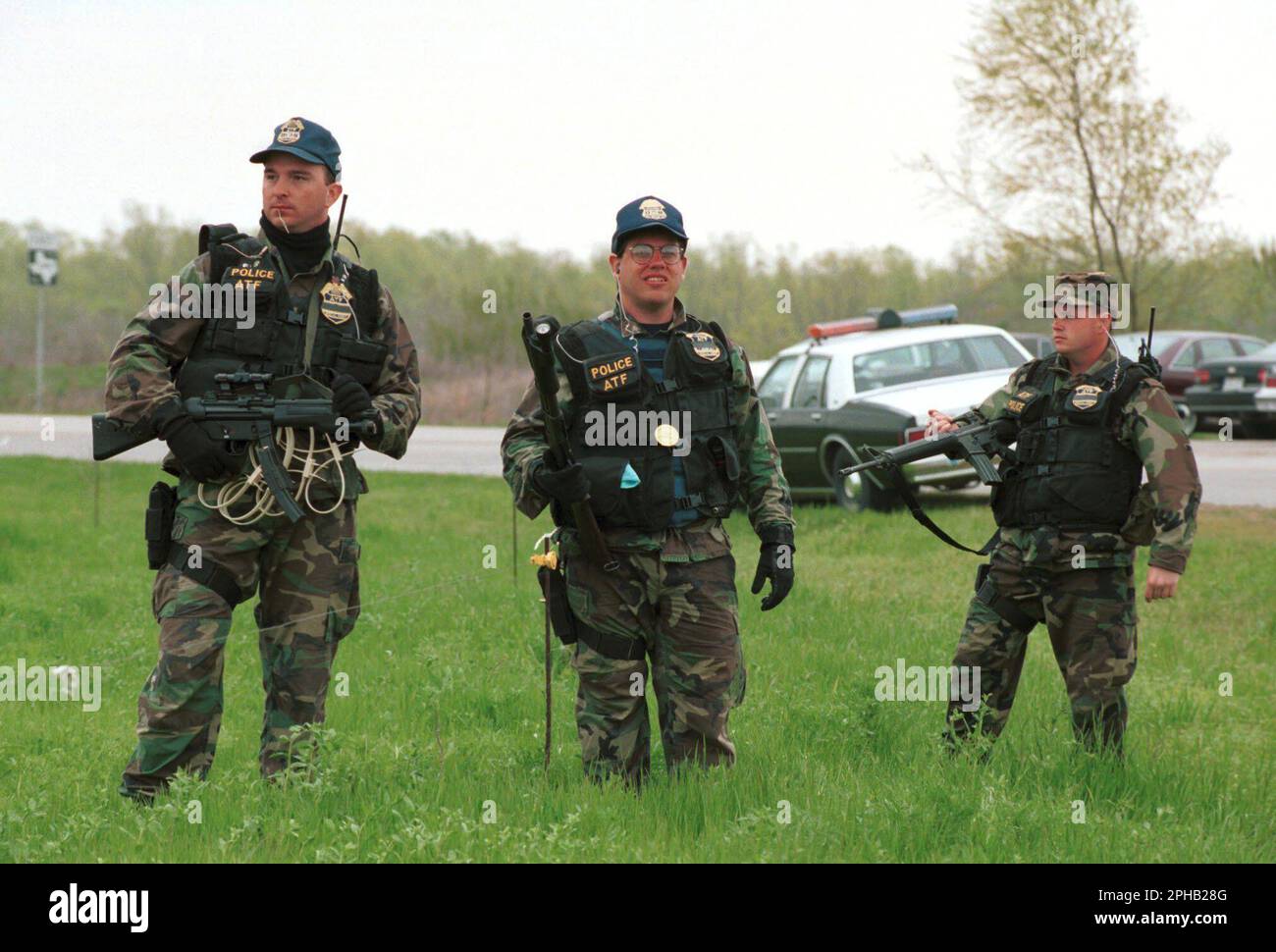 Waco Texas USA, March 1993: Heavily armed members of the federal bureau of Alcohol, Firearms and Tobacco (ATF) guard a road leading to the Branch Davidian compound in the midst of the 51-day standoff between law enforcement agencies and members of the Davidian religious group. ©Bob Daemmrich Stock Photo