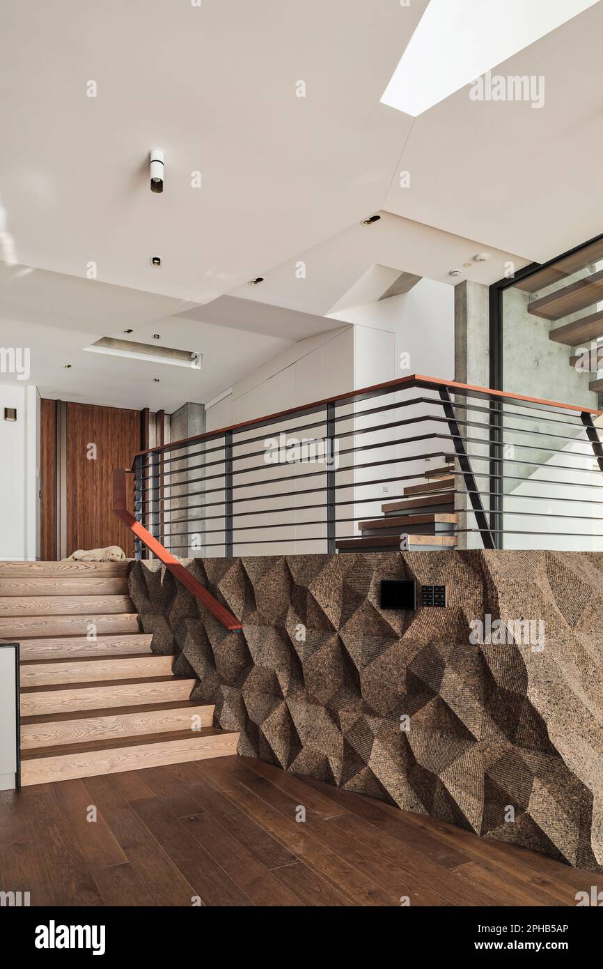Front entrance and landing with feature cork wall. Ravine House, South