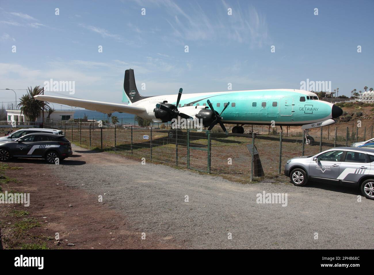 A preserved Douglas DC7C Seven Seas advertising Getaway Real Estate at El Berriel Bahia Feliz