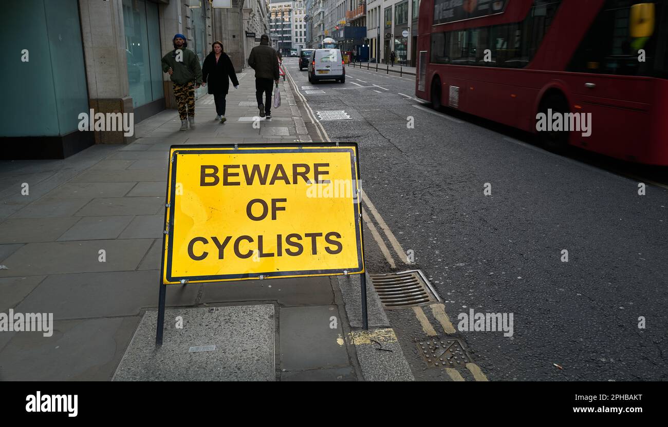 'Beware of cyclists' warning notice on a pavement in Moorgae, the City ...