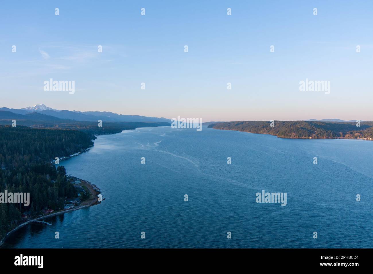 Aerial view of the Puget Sound and the Olympic Mountains at sunset ...
