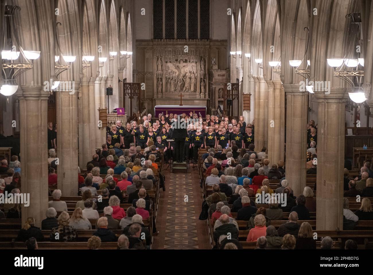 Rock Choirs from Essex and Suffolk perform at Long Melford Church 24 March 2023 © Brian Harris Members of the Rock Choir from different choirs in Esse Stock Photo