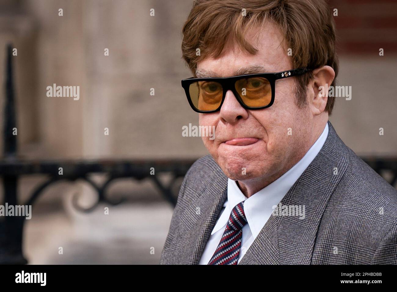 Sir Elton John leaves the Royal Courts Of Justice, central London, following a hearing claim over allegations of unlawful information gathering brought against Associated Newspapers Limited (ANL) by seven people - the Duke of Sussex, Baroness Doreen Lawrence, Sir Elton John, David Furnish, Liz Hurley, Sadie Frost and Sir Simon Hughes. Picture date: Monday March 27, 2023. Stock Photo