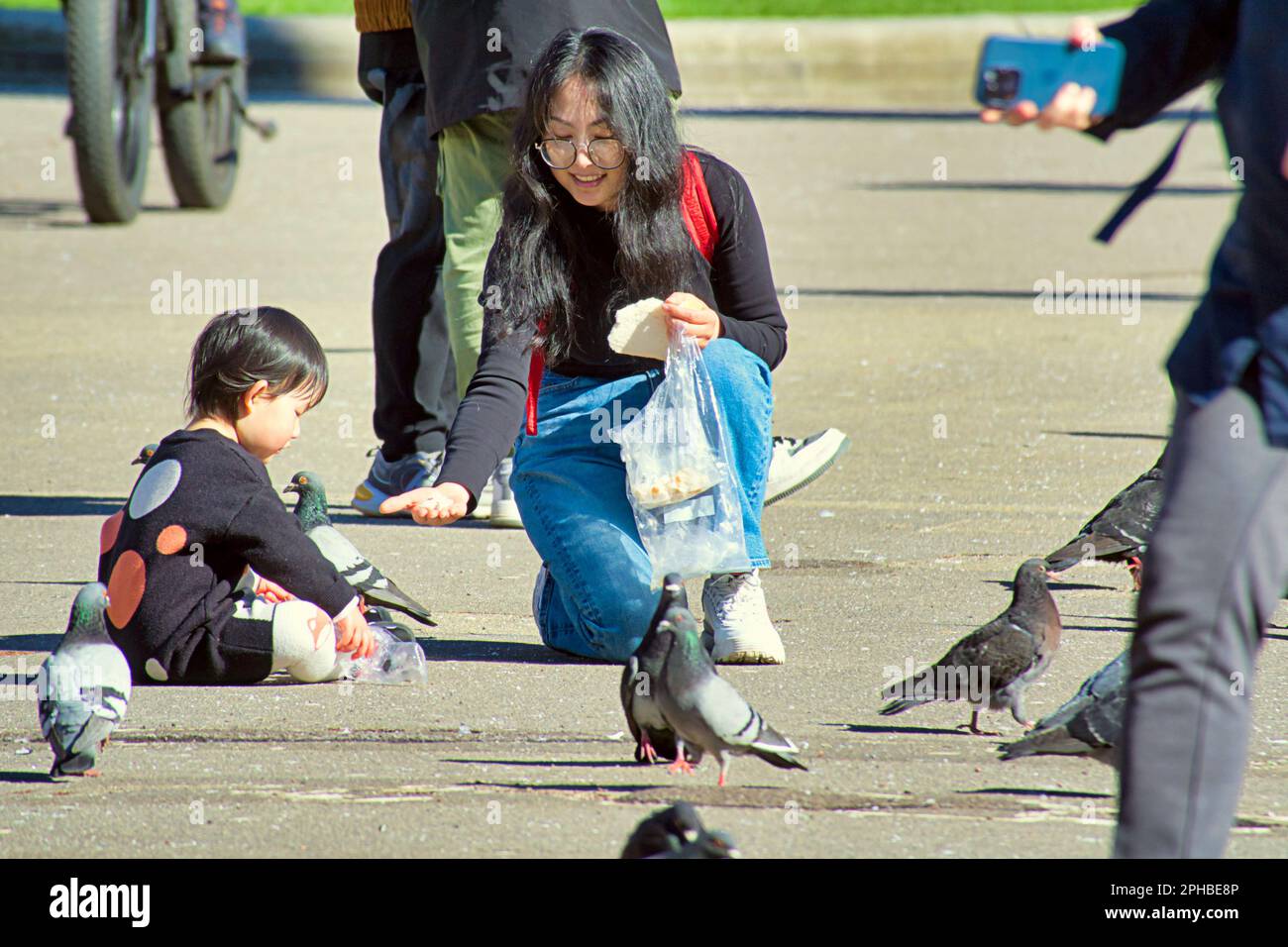 Glasgow, Scotland, UK 27th March, 2023. UK Weather: Sunny in the city centre afternoon saw the locals take to the streets. Fun in george square where witherspoons have been granted leave for permament outside tables for their 'the counting house' pub to give it a more continrntal feel. Credit Gerard Ferry/Alamy Live News Stock Photo